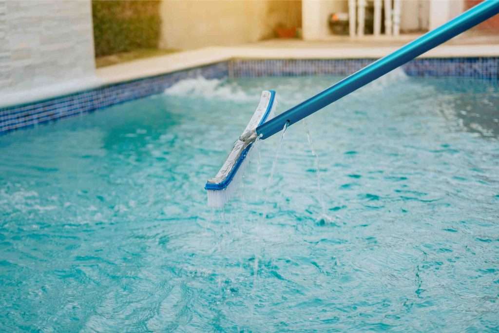 pool brushing for pool maintenance in singapore