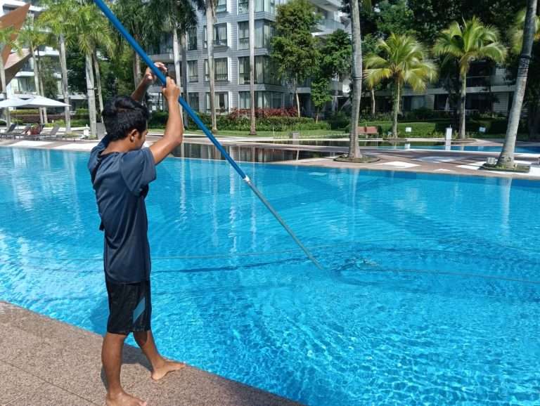 pool maintenance specialist from watercraft engineering singapore checking serviceability of pool equipment